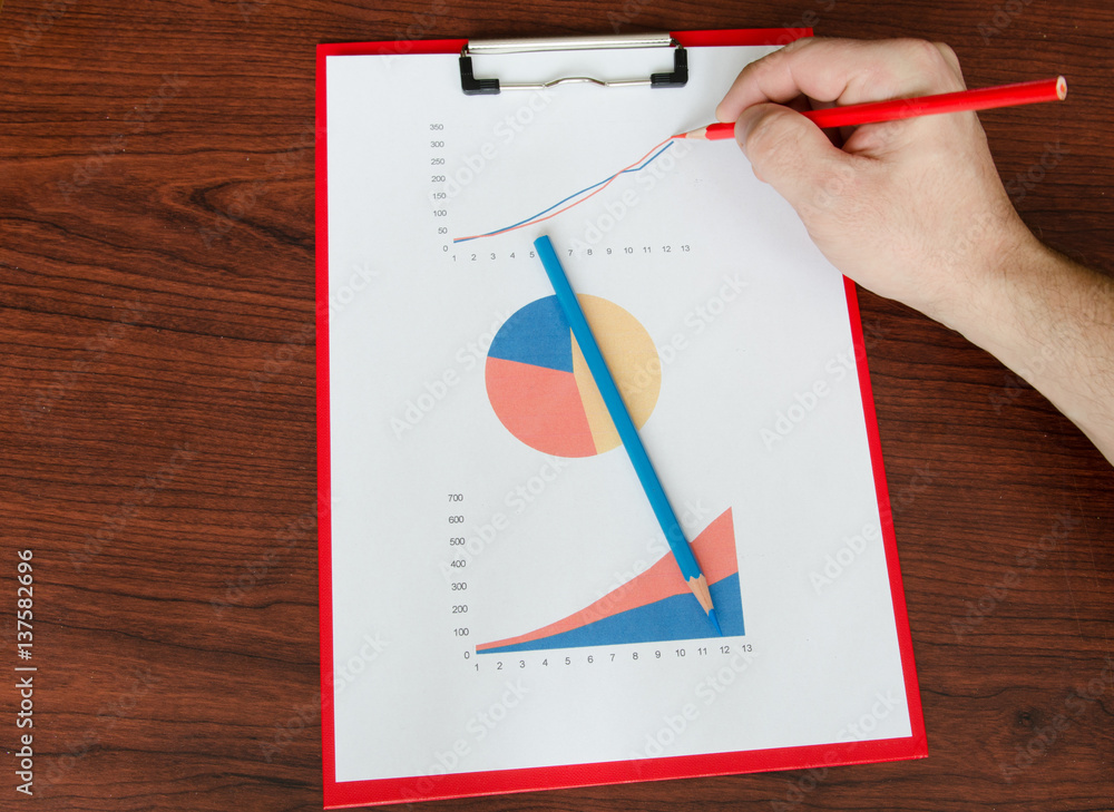 businessman hand drawing a graph with a pencil businessman hand drawing a graph with a pencil