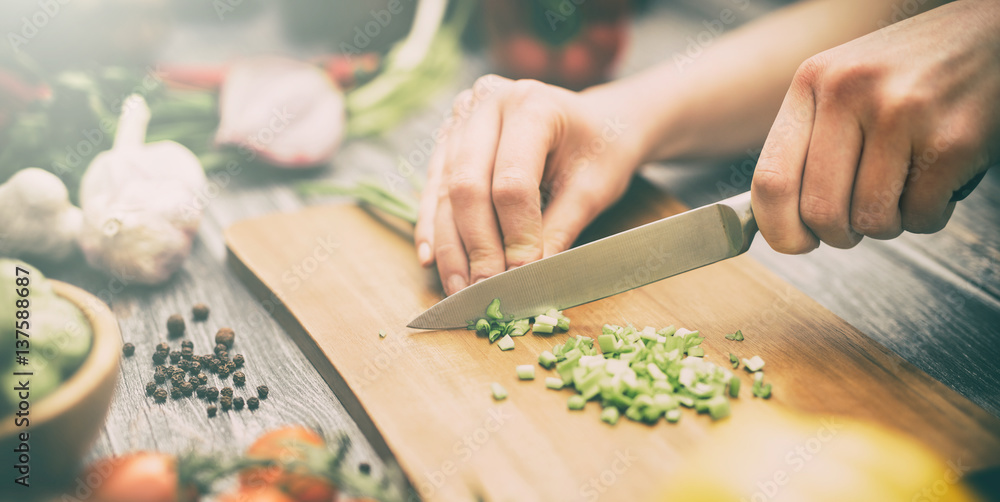 The chef slicing vegetables. - obrazy, fototapety, plakaty 