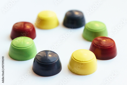 Colored plastic caps isolated on white background