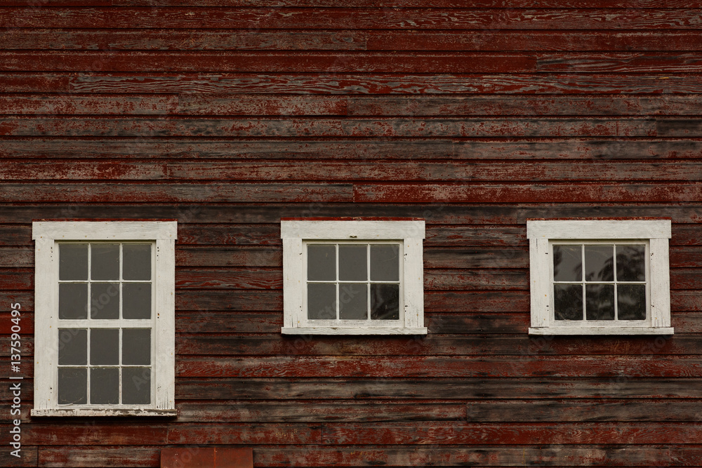 Old Barn windows with weathered red pain