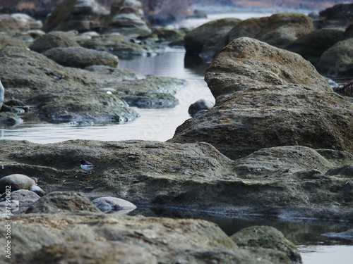 Water flowing between eroded rocks