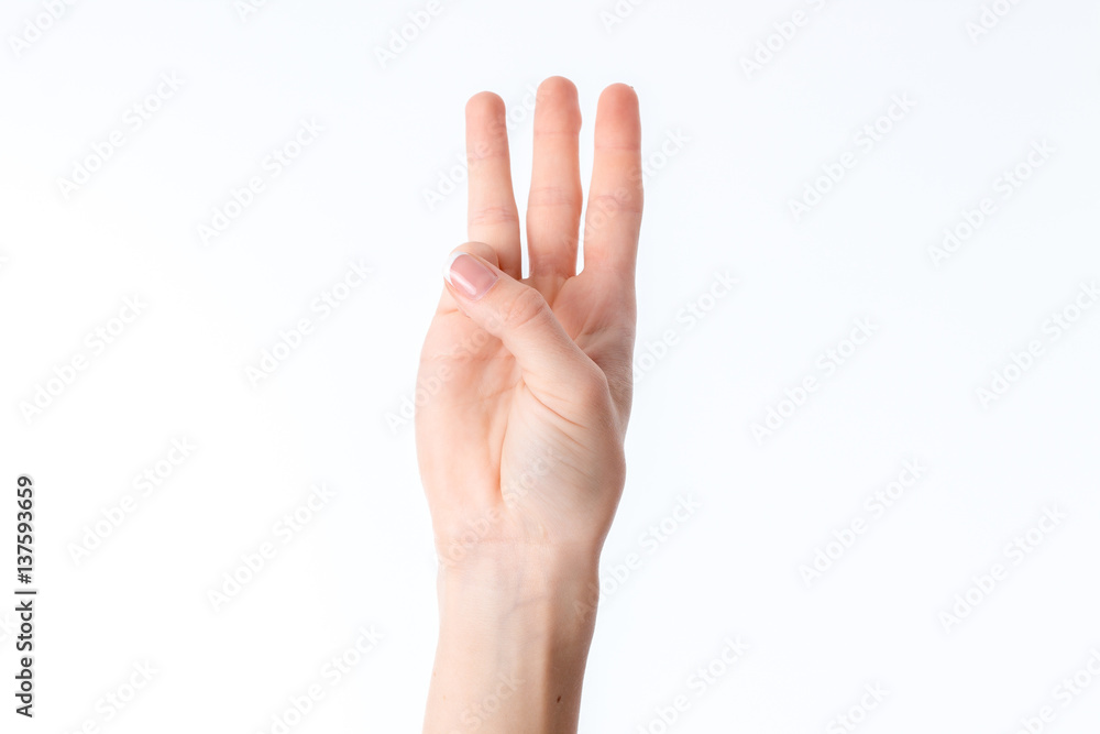 female hand stretched up and showing three fingers isolated on white background female hand stretched up and showing three fingers isolated on white background