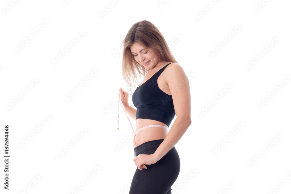 Pretty slender girl standing sideways looks down Pretty slender girl standing sideways looks down
