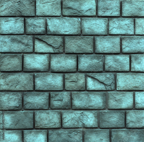 Blue wall of hard decorative stone.Roughness uneven wall background.Design element.Abstract blue web banner