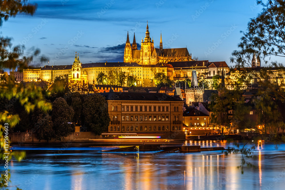 Fototapeta premium Saint Vitus Cathedral and Vltava river in evening lights, Prague, Czech Republic