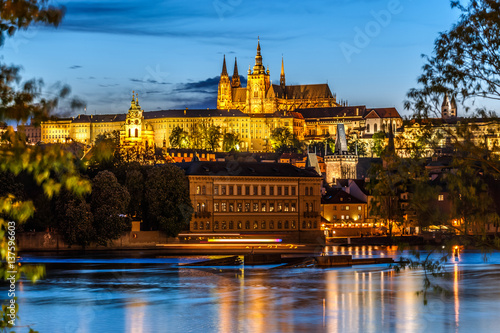 Saint Vitus Cathedral and Vltava river in evening lights, Prague, Czech Republic