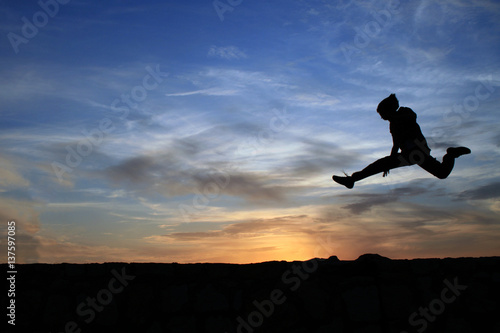 Wallpaper Mural Child jumping over rocks Torontodigital.ca