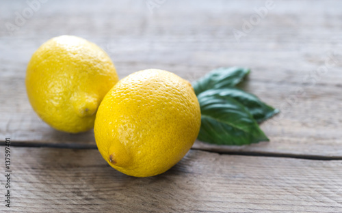 Fresh lemons on the wooden background