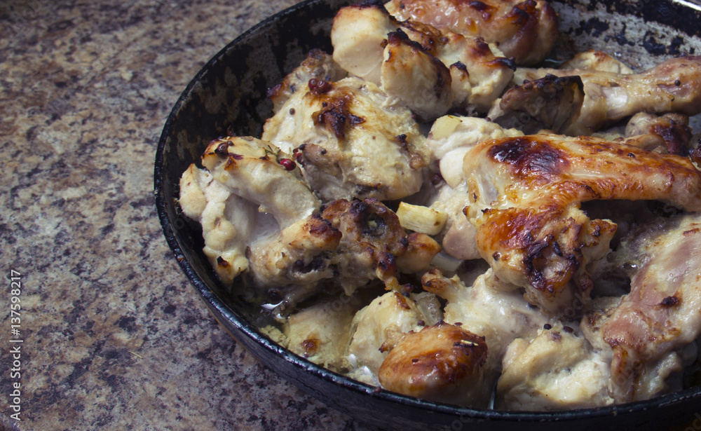 chicken in mustard sauce. chicken pieces in the pan. cooking. The