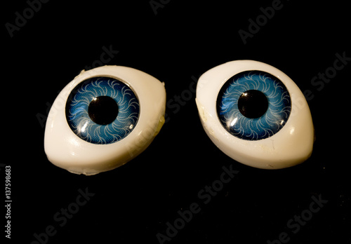 Fototapet Detached Dolly Eyes With Blue Iris on Black Background