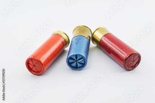 three hunting cartridges on white bakcground