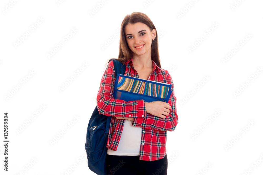 cheerful stylish smart student girl with backpack on her shoulders and folders for notebooks in hands posing and smiling on camera isolated on white background cheerful stylish smart student girl with backpack on her shoulders and folders for notebooks in hands posing and smiling on camera isolated on white background