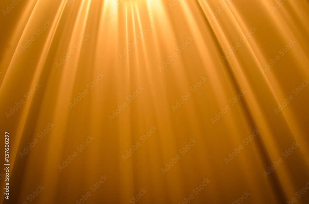 Naklejka premium Smooth creases and folds on a orange fabric with upper lighting and deep shadows 