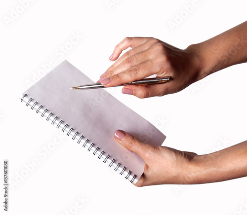Woman hand with pen and notebook 