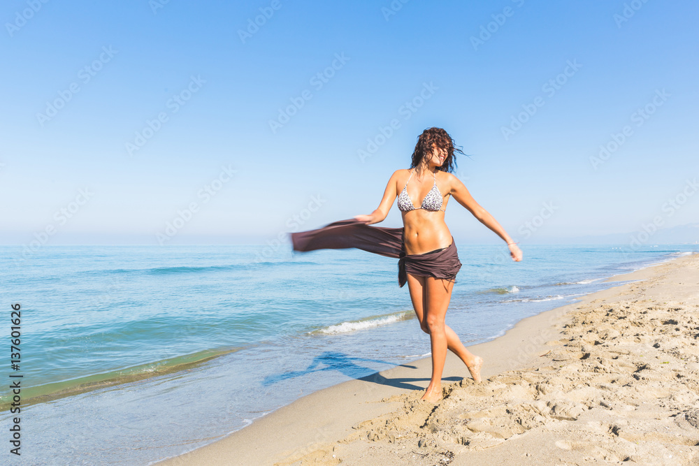 Happy girl having fun at beach