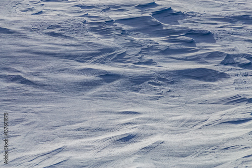 Wind effected snow cover with strong shadows © kenzie