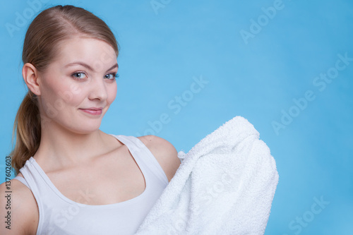 Attractive woman holding big white towel