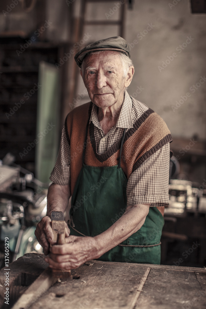 Portrait of carpenter working in workshop Portrait of carpenter working in workshop