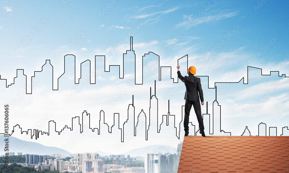Man architect draw silhouette of modern city on blue sky. Mixed media Man architect draw silhouette of modern city on blue sky. Mixed media