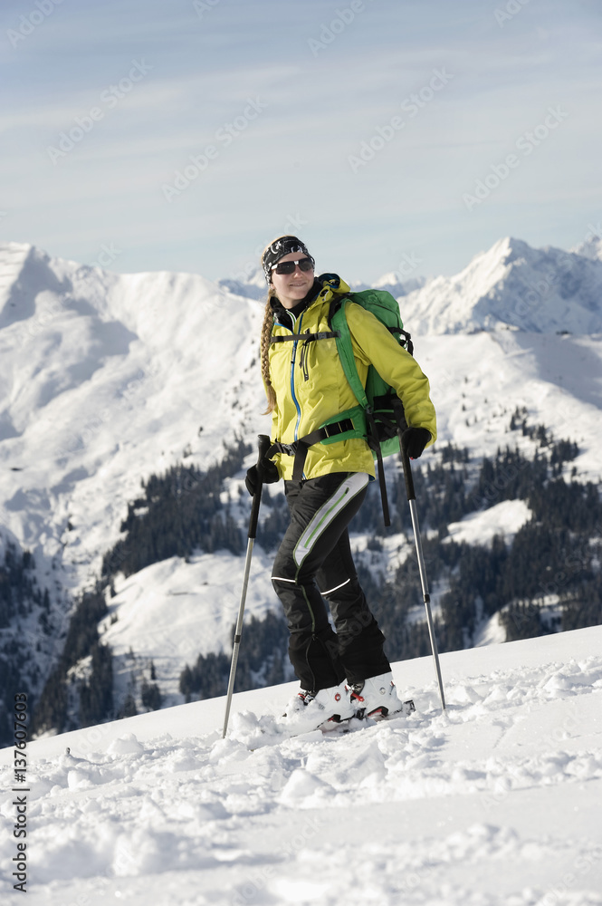 Female backcountry skier, mountain range in background, Alpbachtal, Tyrol, Austria, Europe Female backcountry skier, mountain range in background, Alpbachtal, Tyrol, Austria, Europe