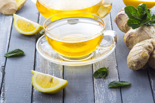 tea ginger lemon mint vintage wood background 