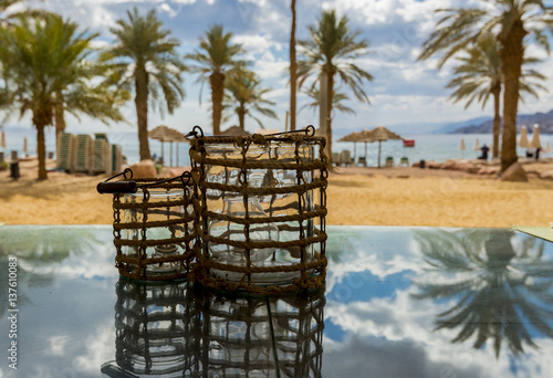 Central public beach in Eilat - famous resort and recreational city in Israel. Selective focus on decorative candles