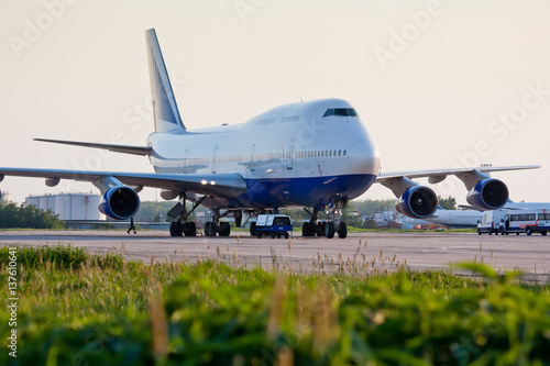 Boeing 747 on the airfield. Long-haul aircraft. Ready to takeoff on the runway. Passenger commercial air transportation. photo