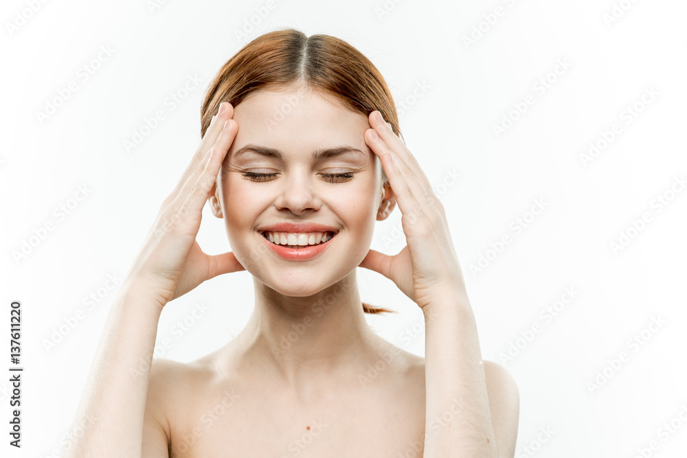beautiful woman with closed eyes touches her face with her hands beautiful woman with closed eyes touches her face with her hands