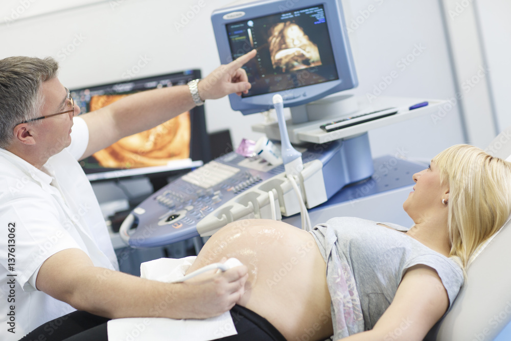 Pregnant woman having an ultrasound Pregnant woman having an ultrasound