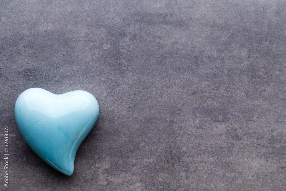 Fototapeta premium Colored heart on the gray background.
