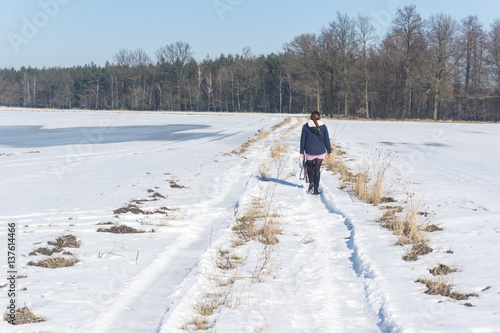 girl walks in winter outside the city