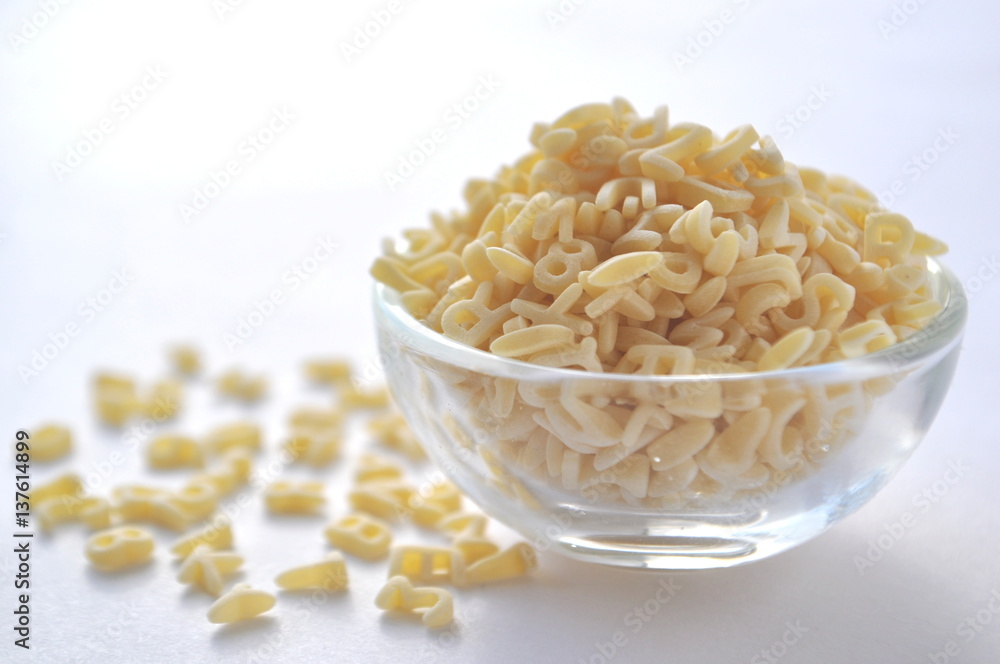 Alphabet pasta for children's meals. ABC pasta. Dry pasta in a glass bowl isolated on white
Alphabet pasta for children's meals. ABC pasta. Dry pasta in a glass bowl isolated on white
