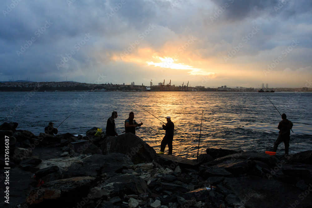 turkish fishermen sunset Istanbul