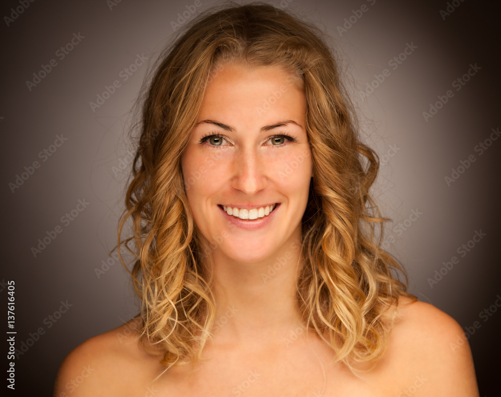 Beauty portrait of a cute brunette woman with curly hair over black background Beauty portrait of a cute brunette woman with curly hair over black background