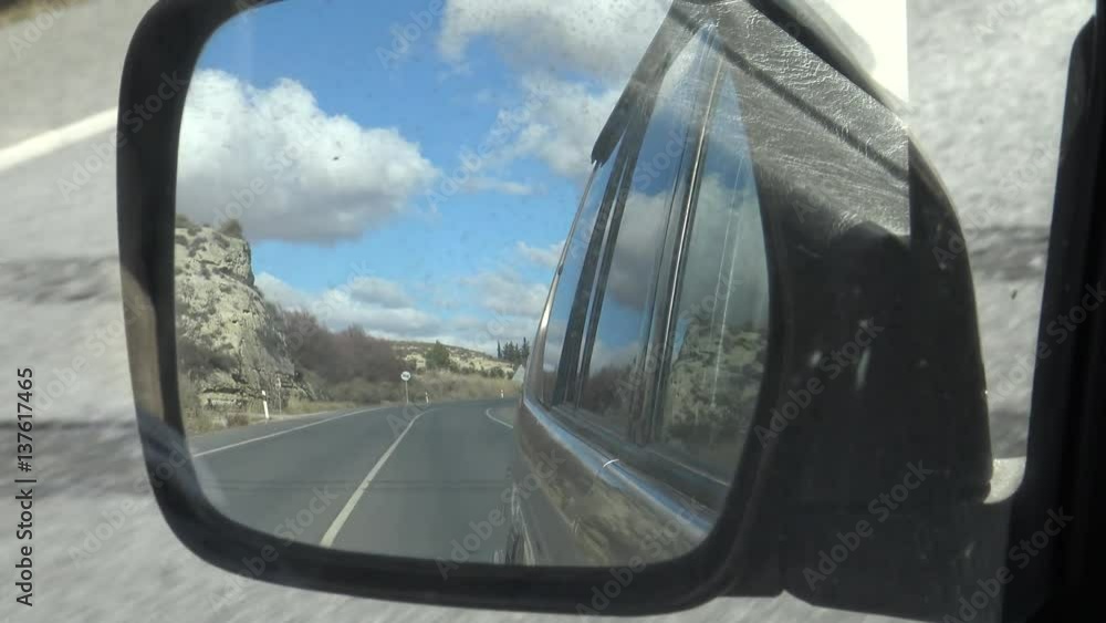 4K Car mirror while driving in the long road through beautiful countryside in Spain. Spanish landscape of the field-Dan 4K Car mirror while driving in the long road through beautiful countryside in Spain. Spanish landscape of the field-Dan