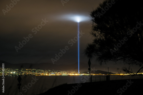 Nighttime view on Hobart, Tasmania from eastern shore shows a strobe of light during 2013 Dark Mofo Art festival photo