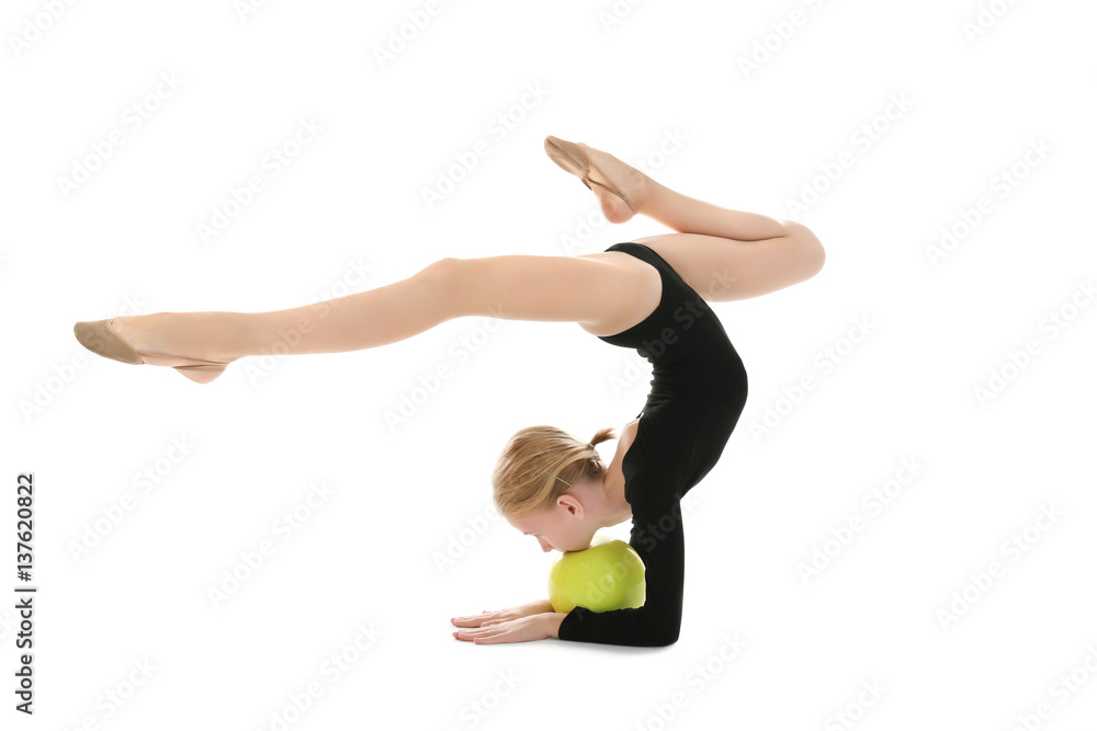 Young girl doing gymnastic exercise with ball, isolated on white Young girl doing gymnastic exercise with ball, isolated on white
