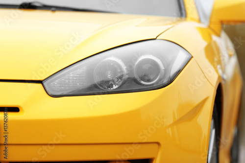 Closeup of yellow car headlight