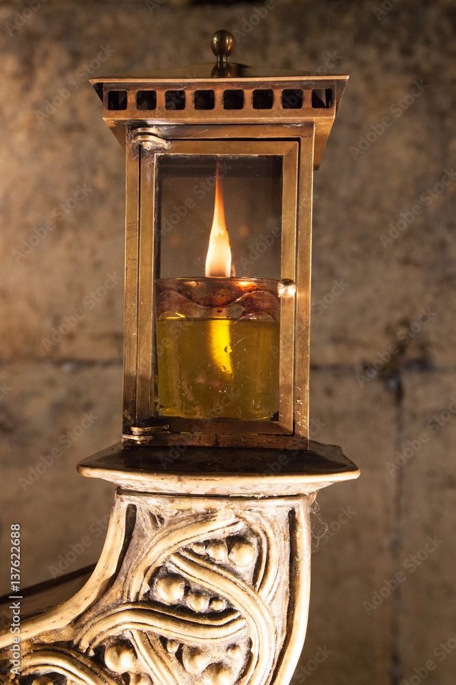 HanuHanukiah lit with the wailing wall in background - zoom on a light HanuHanukiah lit with the wailing wall in background - zoom on a light