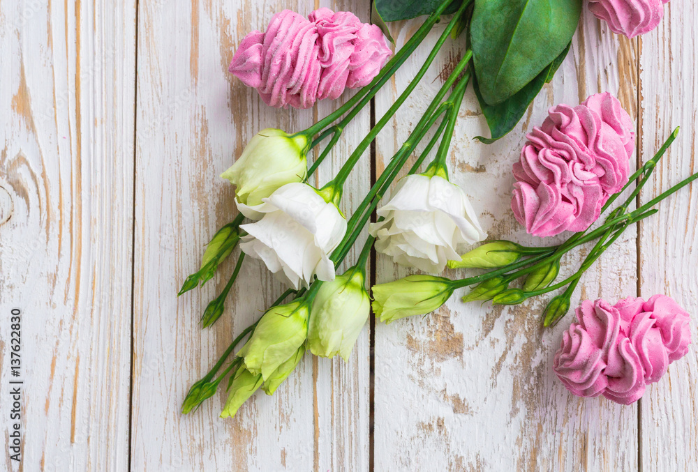 Homemade marshmallow dessert, vanilla sticks and white eustoma flowers. Homemade marshmallow dessert, vanilla sticks and white eustoma flowers.