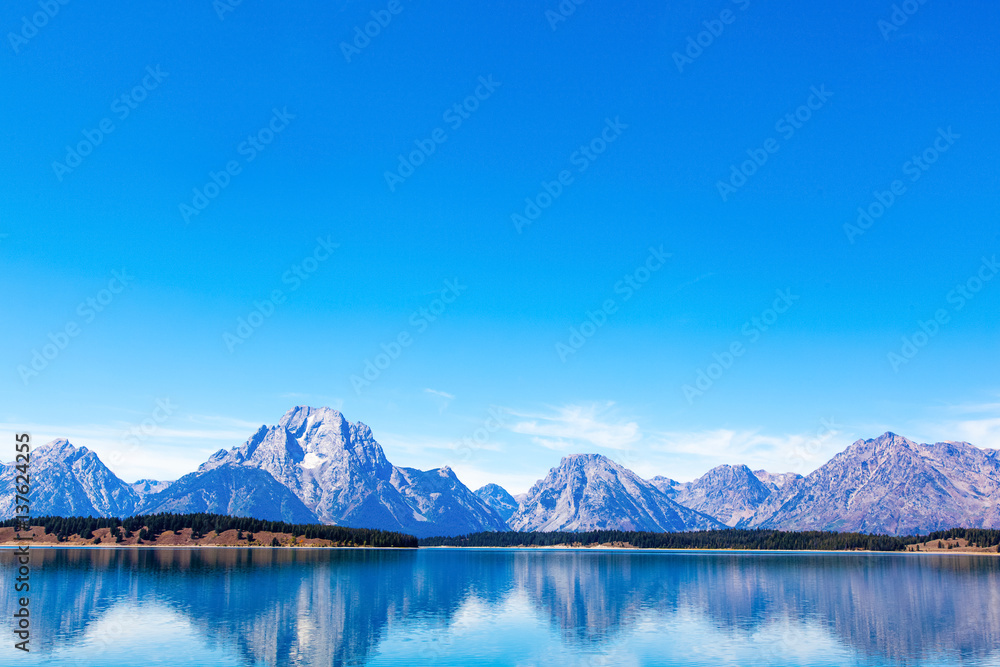 Grand Teton National Park, Wyoming.  Reflection of mountains on Jackson Lake near Yellowstone.