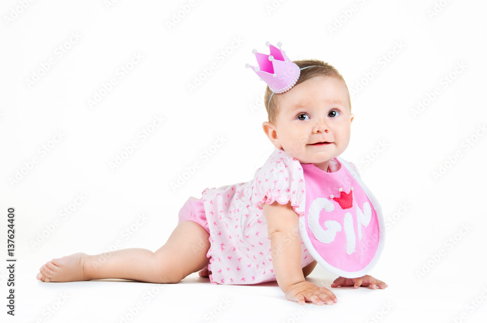Girl with a crown, sitting in a bib on a white background.