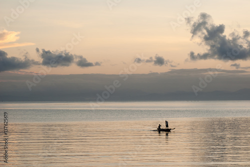 Silhouette of fishermen at sunrise © leonardovillasis