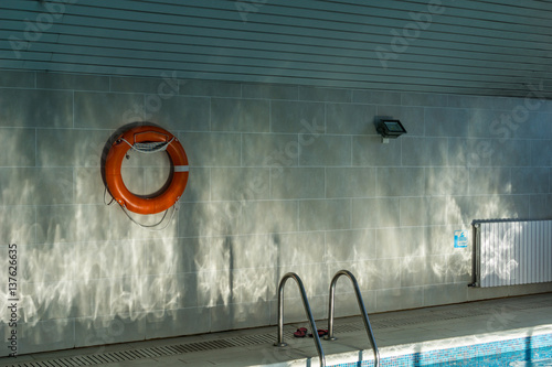 water reflecting sun on a swimming pool wall