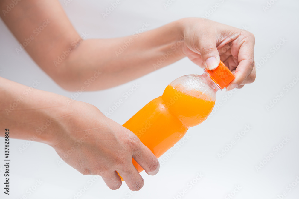 open bottle caps of orange juice open bottle caps of orange juice