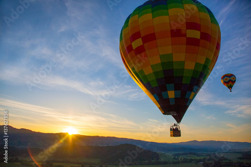 Hot Air Balloon Over Vineyards At Sunrise Over Napa Valley, Napa, California USA photo