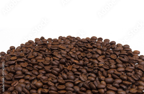 Roasted coffee beans on white.