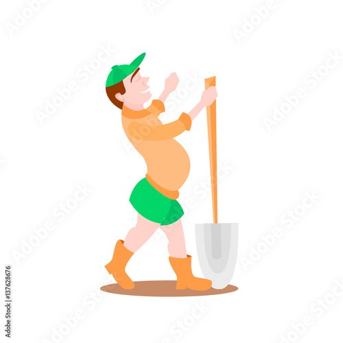 little boy with big shovel in the field