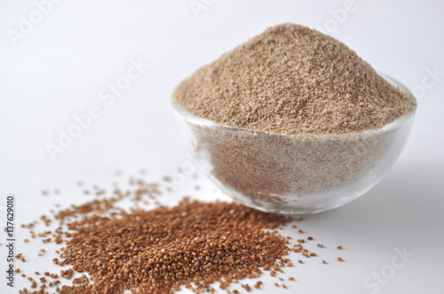 Teff grain from Africa. Smallest grain in the world. Alternative gluten-free flour for baking and cooking. Isolated on white 