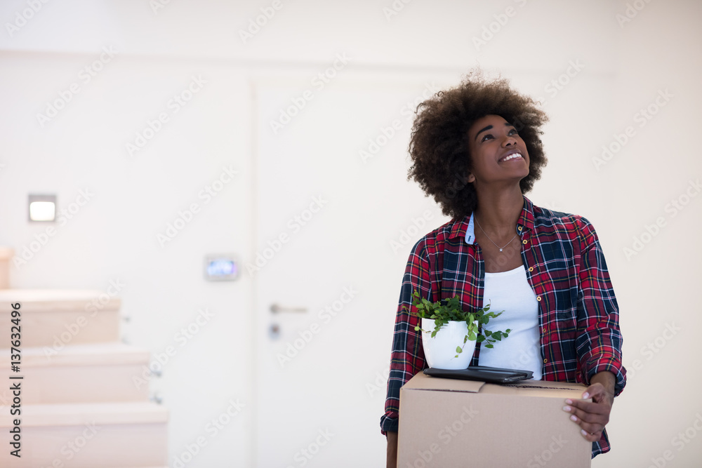 © .shock - Black girl moving in the new apartment © .shock - Black girl moving in the new apartment